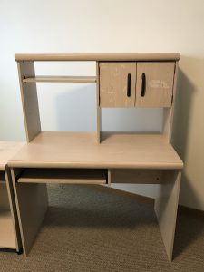 blond laminate wood computer desk with a hutch