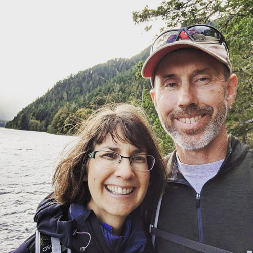 A photo of Jill Annis and her husband in Olympic National Park